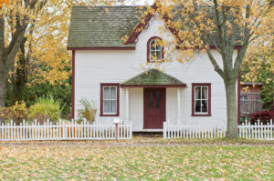 house with leaves on the lawn. Residential pest control serving Colorado Springs and Falcon, CO is our top priority.